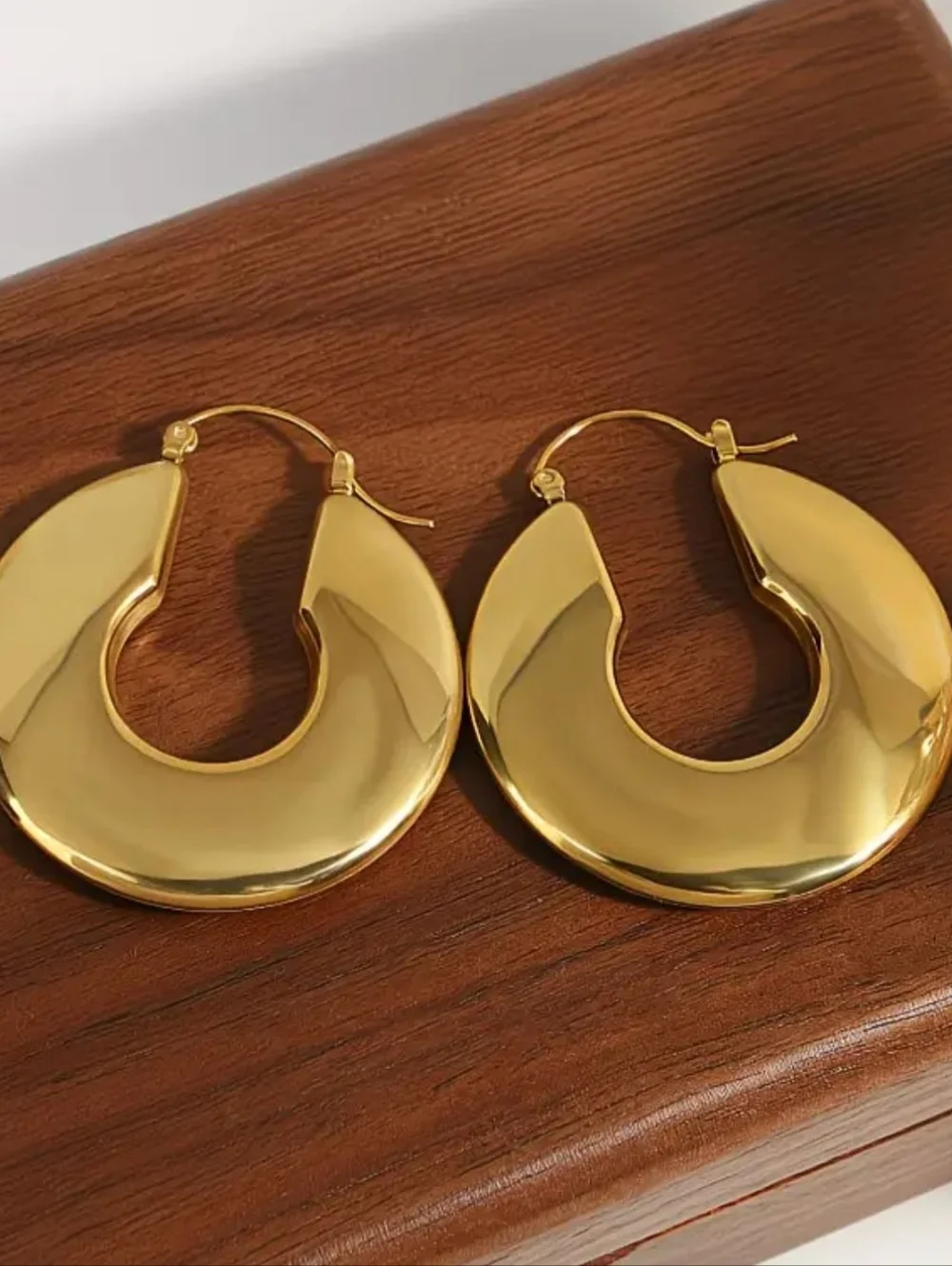Chucky gold hoop earrings; 1.57